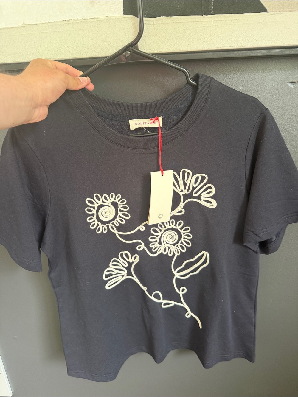 Solitaire Black Tee with White Floral Line Design